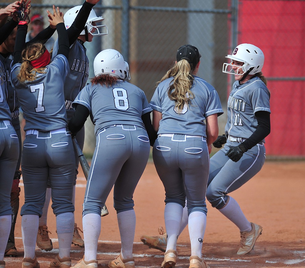 Bradshaw Mountain's Jacie Hambrick gets congratulated by her team mates after stroking a first inning home run as the Bears host the Prescott Badgers Thursday, April 11 in Prescott Valley. (Les Stukenberg/Courier)