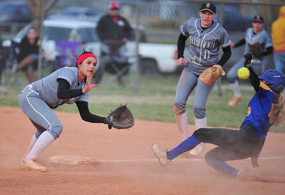 Bradshaw Mountain's Yesenia Gomez waits on the throw as Danner Cozens slides as the Bears host the Prescott Badgers Thursday, April 11 in Prescott Valley. (Les Stukenberg/Courier)