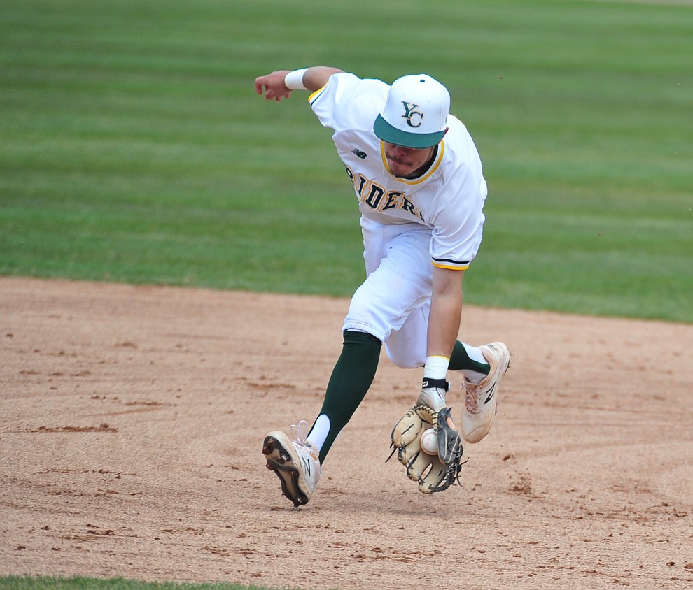 Yavapai's Channy Ortiz chases down a ball at shortstop as the Roughriders take on Gateway Community College Wednesday, April 17 at in Prescott. (Les Stukenberg/Courier)