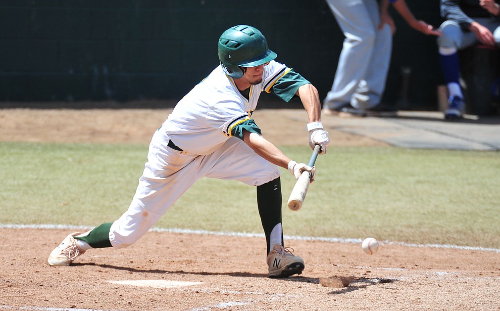 Yavapai's Rocky Botello lays down a bunt as the Roughriders take on Gateway Community College Wednesday, April 17 at in Prescott. (Les Stukenberg/Courier)
