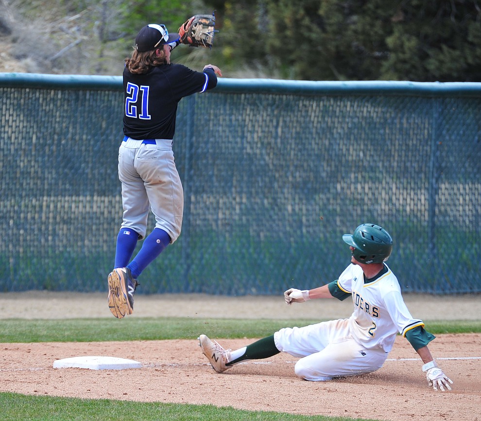 Yavapai's Rocky Botello slides into third as the Roughriders take on Gateway Community College Wednesday, April 17 at in Prescott. (Les Stukenberg/Courier)