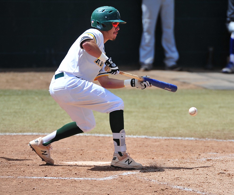 Yavapai's Channy Ortiz lays down a bunt as the Roughriders take on Gateway Community College Wednesday, April 17 at in Prescott. (Les Stukenberg/Courier)