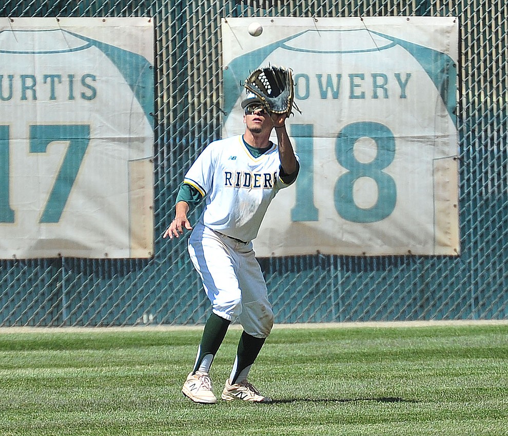 Yavapai's Rocky Botello makes the catch in left field as the Roughriders take on Gateway Community College Wednesday, April 17 at in Prescott. (Les Stukenberg/Courier)