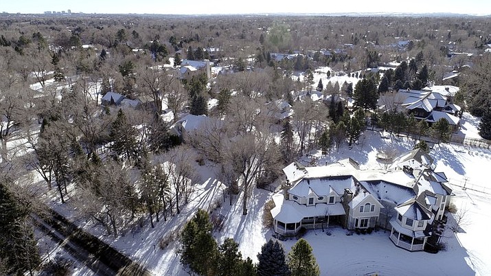 This Jan. 3, 2019 photo shows snow covered Swastika Acres in Englewood, Colo. The neighborhood in the Denver suburb was named Swastika Acres decades before the symbol was adopted by the Nazis. KDVR-TV reports the Cherry Hills Village City Council voted unanimously Tuesday, April 16, 2019, to approve a name change to "Old Cherry Hills" to prevent future controversy. (Hyoung Chang/The Denver Post via AP)