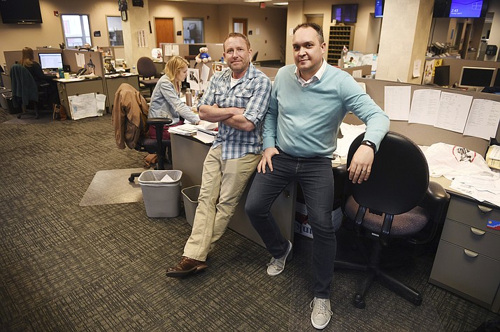 In this April 9, 2019, photo, Argus Leader investigative reporter Jonathan Ellis and news director Cory Myers in the newsroom in Sioux Falls, S.D. In 2010, reporters at South Dakota’s Argus Leader newspaper came up with the idea of requesting data about the government’s food assistance program. They thought the information about the $65-billion dollar-a year program, previously known as food stamps, could lead to a series of stories and help them identify possible fraud. But the government didn’t provide everything the paper wanted. Trying to get the data has taken the paper more than eight years and landed the case at the Supreme Court. (Briana Sanchez/The Argus Leader via AP)