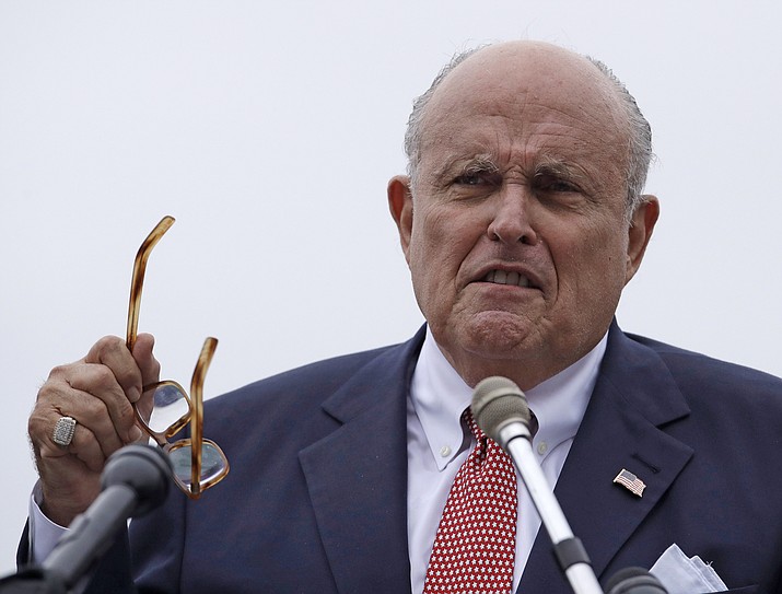 In this Aug. 1, 2018, file photo, Rudy Giuliani, an attorney for President Donald Trump, speaks in Portsmouth, N.H. President Donald Trump's lawyers are putting the finishing touches on a rebuttal to the forthcoming report by special counsel Robert Mueller. Giuliani, one of the president's attorneys, said Tuesday, April 16, 2019, that their document will be dozens of pages long. (Charles Krupa/AP, file)