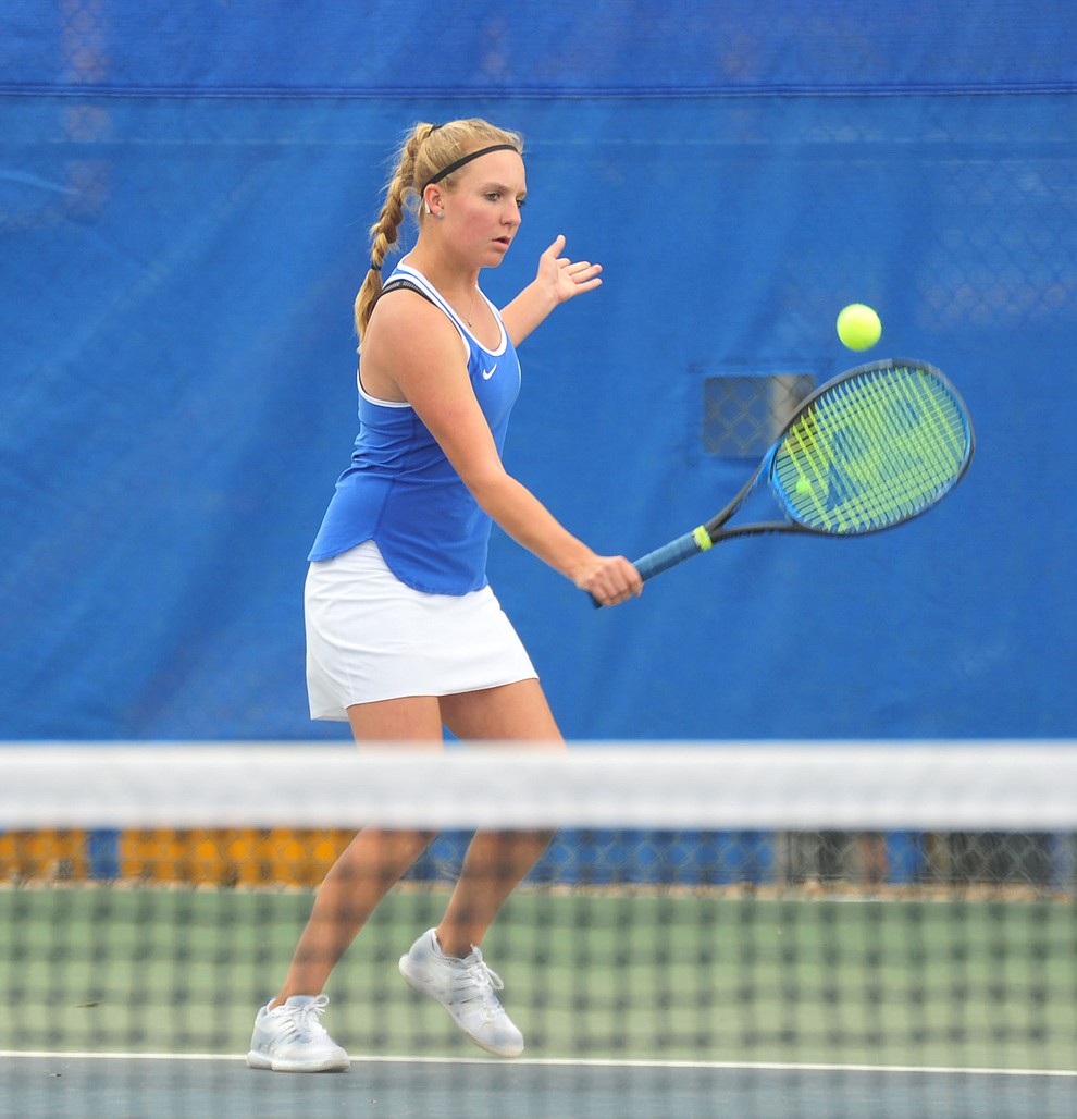 Prescott's Ava Andrews hits a return shot as the Badgers play Ironwood Ridge in the first round of the Arizona Interscholastic Association State Team Tennis Tournament Tuesday, April 23 in Prescott. (Les Stukenberg/Courier)