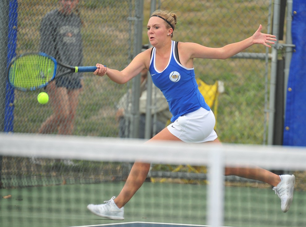 Prescott's Ava Andrews hits a return shot as the Badgers play Ironwood Ridge in the first round of the Arizona Interscholastic Association State Team Tennis Tournament Tuesday, April 23 in Prescott. (Les Stukenberg/Courier)