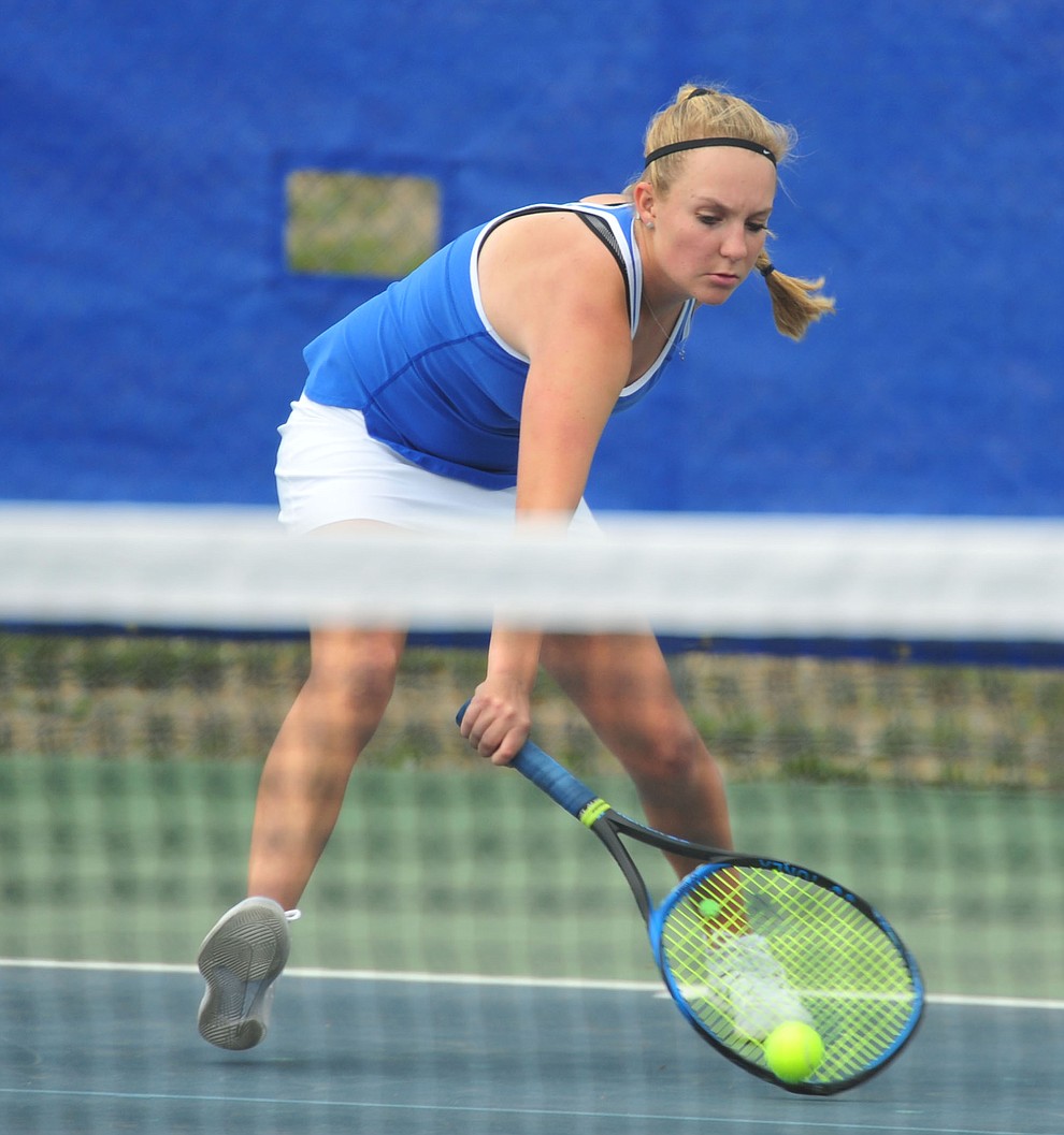 Prescott's Ava Andrews hits a return shot as the Badgers play Ironwood Ridge in the first round of the Arizona Interscholastic Association State Team Tennis Tournament Tuesday, April 23 in Prescott. (Les Stukenberg/Courier)