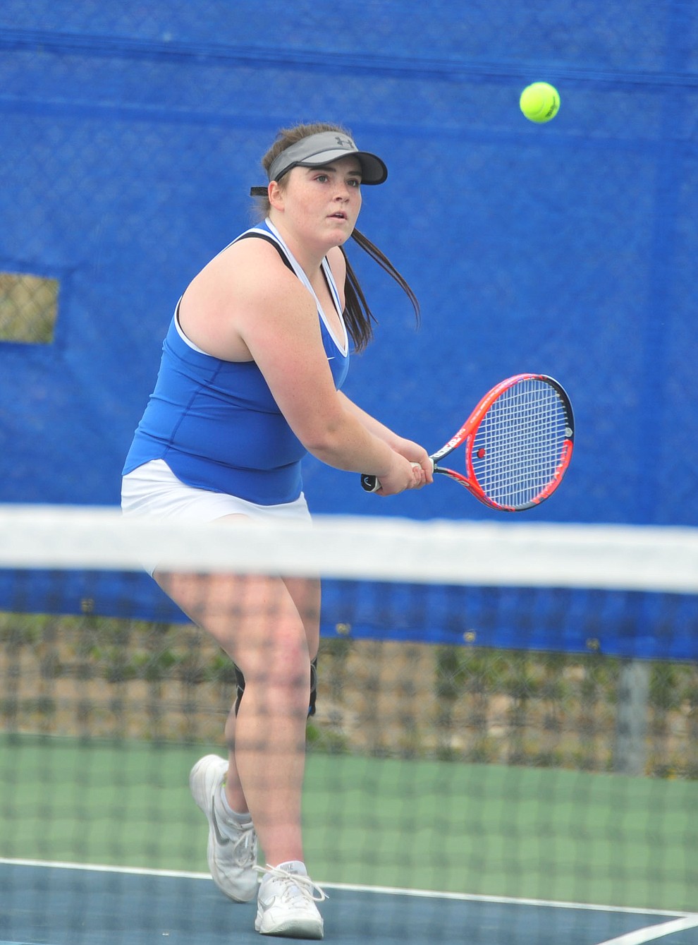 Prescott's Ellie Fenderson hits a return shot as the Badgers play Ironwood Ridge in the first round of the Arizona Interscholastic Association State Team Tennis Tournament Tuesday, April 23 in Prescott. (Les Stukenberg/Courier)