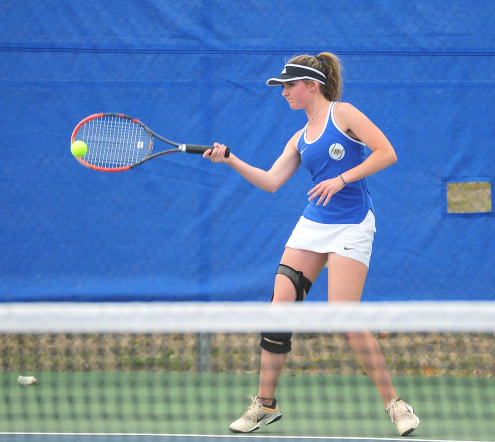 Prescott's Riley Smith hits a return shot as the Badgers play Ironwood Ridge in the first round of the Arizona Interscholastic Association State Team Tennis Tournament Tuesday, April 23 in Prescott. (Les Stukenberg/Courier)