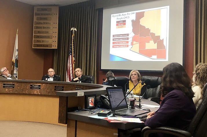 Members of the Prescott City Council listen to a report about the opioid crisis during a February meeting, prior to voting to pursue a lawsuit against pharmaceutical companies. The lawsuit is asking for damages for the harms the community has suffered from the opioid epidemic. (Cindy Barks/Courier, file)