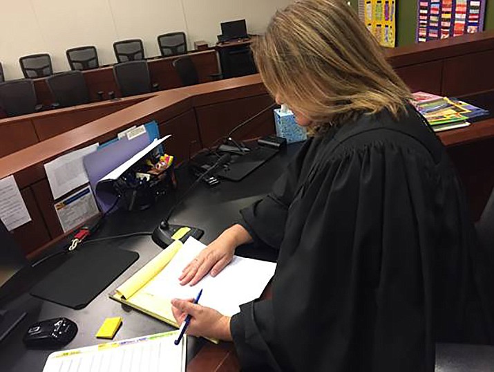 A Yavapai County Superior Court judge looks over paperwork March 2, 2018. The Arizona Supreme Court ruled Thursday, April 25, 2019, that family courts have no right to interfere with the decisions of a parent given sole legal custody of a child after a divorce. (YCSC/Courtesy)