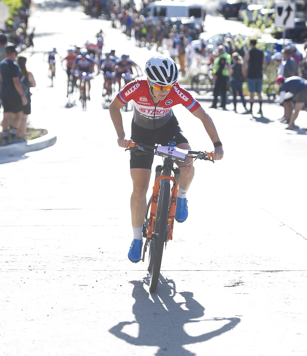 Chloe Woodruff leads the first lap during the Whiskey Off Road Fat Tire Crit through the streets of downtown Prescott Friday, April 26. (Les Stukenberg/Courier)