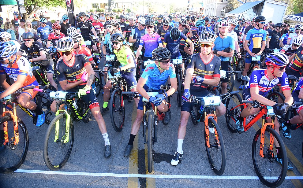 The men are pretty relaxed on the start line before the Whiskey Off Road Fat Tire Crit through the streets of downtown Prescott Friday, April 26. (Les Stukenberg/Courier)
