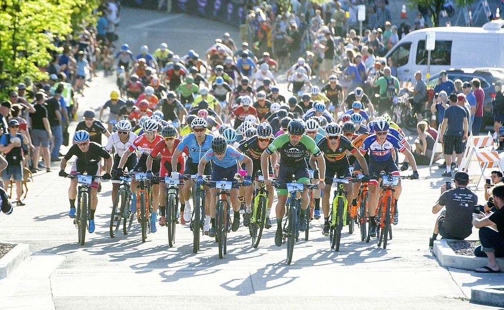The men head up Union Street during the Whiskey Off Road Fat Tire Crit through the streets of downtown Prescott Friday, April 26. (Les Stukenberg/Courier)