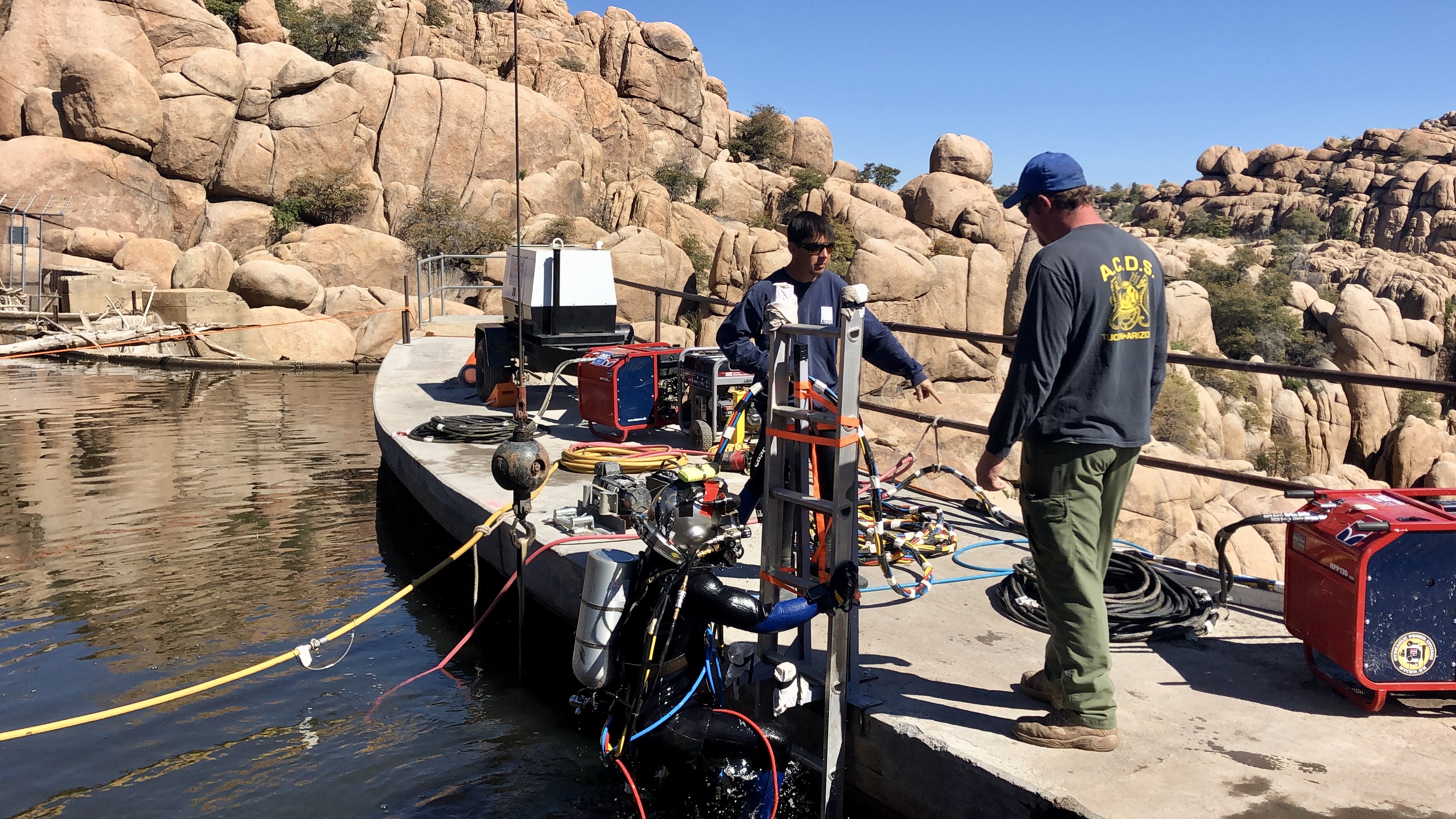 100yearold dam gets needed repairs, divers work to remove sediment at