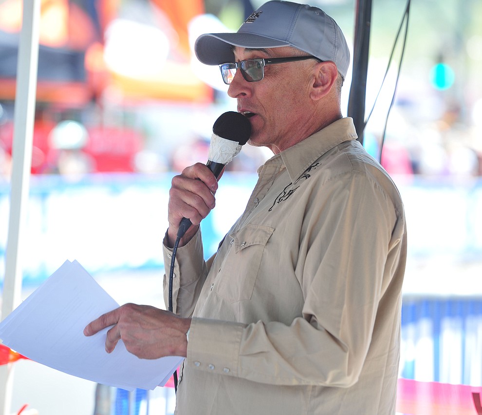 Announcer Larry Grossman on the microphone during the opening day of the Whiskey Off Road in downtown Prescott Friday, April 26. (Les Stukenberg/Courier)