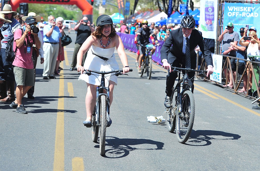 Greg and Bess Dougherty of Indinapolis, IN held their wedding ceremony on the start line on opening day of the Whiskey Off Road in downtown Prescott Friday, April 26 and then rode off together. (Les Stukenberg/Courier)