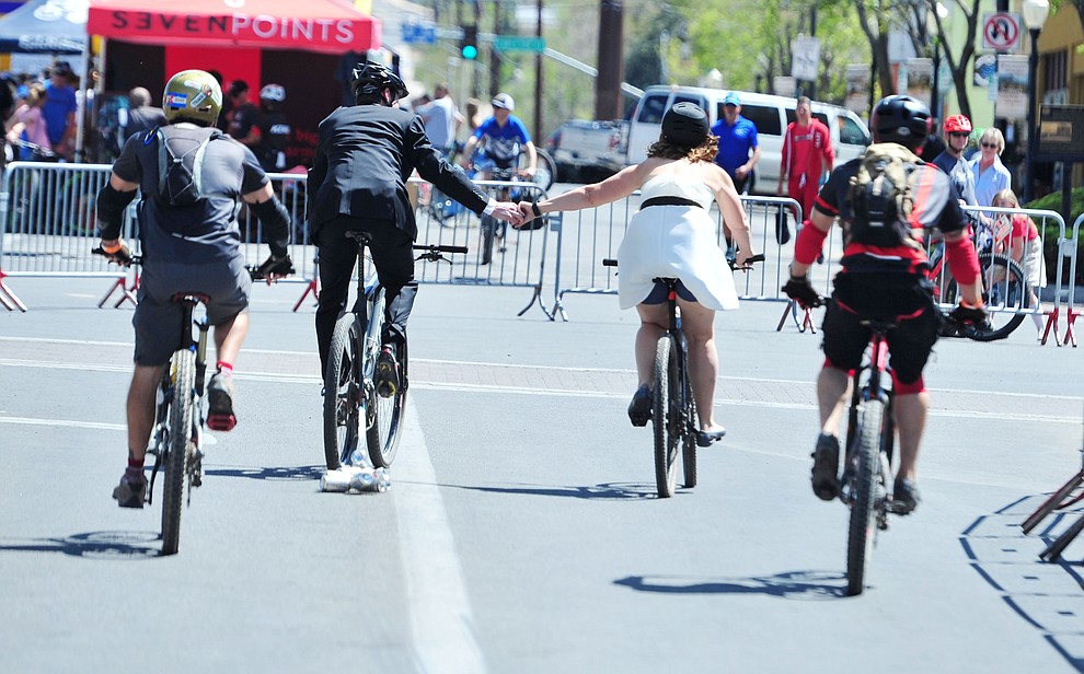 Greg and Bess Dougherty of Indinapolis, IN held their wedding ceremony on the start line on opening day of the Whiskey Off Road in downtown Prescott Friday, April 26 and then rode off together. (Les Stukenberg/Courier)
