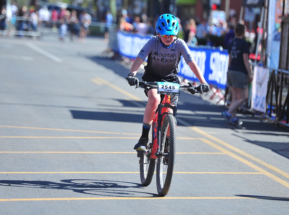 Tyler Remlinger crosses the finish line of the 15-mile race during the opening day of the Whiskey Off Road in downtown Prescott Friday, April 26. (Les Stukenberg/Courier)