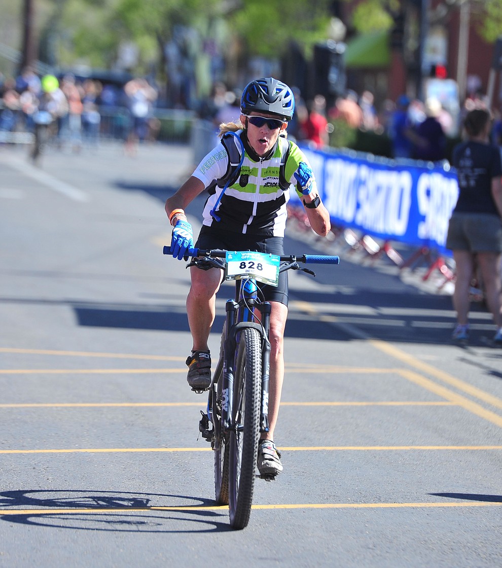 Jeri Kremer was the first lady to cross the finish line of the 15-mile race during the opening day of the Whiskey Off Road in downtown Prescott Friday, April 26. (Les Stukenberg/Courier)