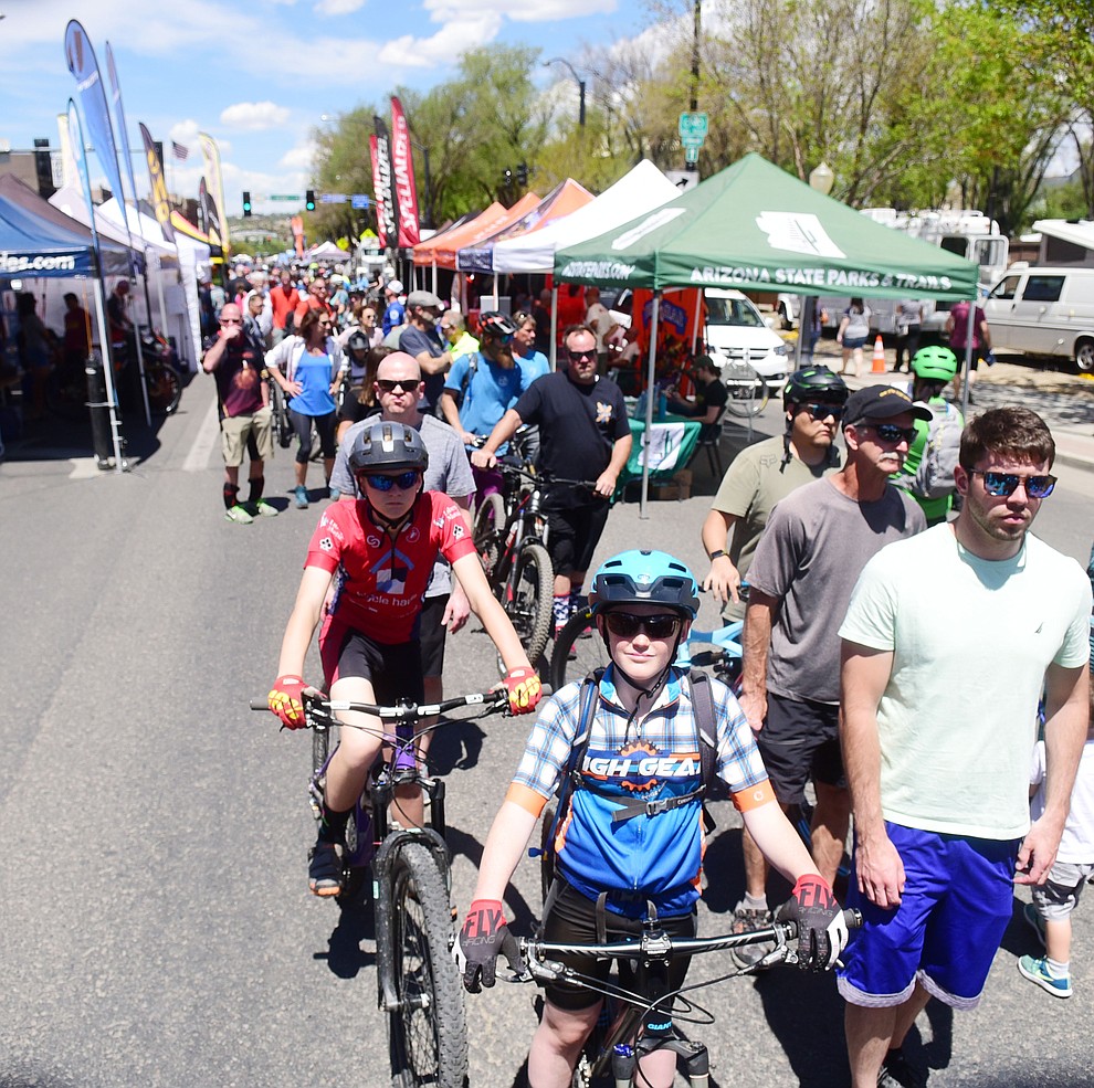 Racers wait in line to get their number plates during the opening day of the Whiskey Off Road in downtown Prescott Friday, April 26. (Les Stukenberg/Courier)