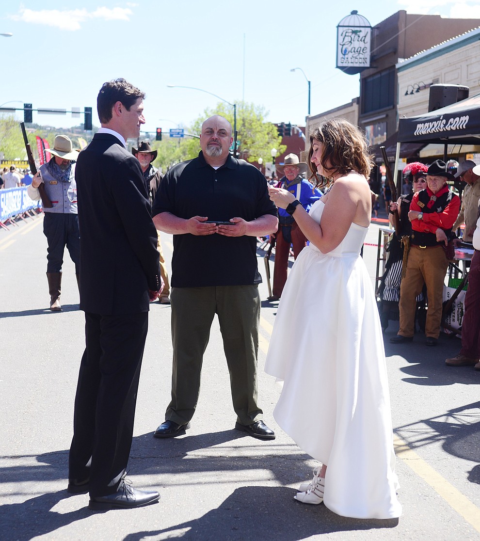 Greg and Bess Dougherty of Indinapolis, IN held their wedding ceremony on the start line on opening day of the Whiskey Off Road in downtown Prescott Friday, April 26. (Les Stukenberg/Courier)