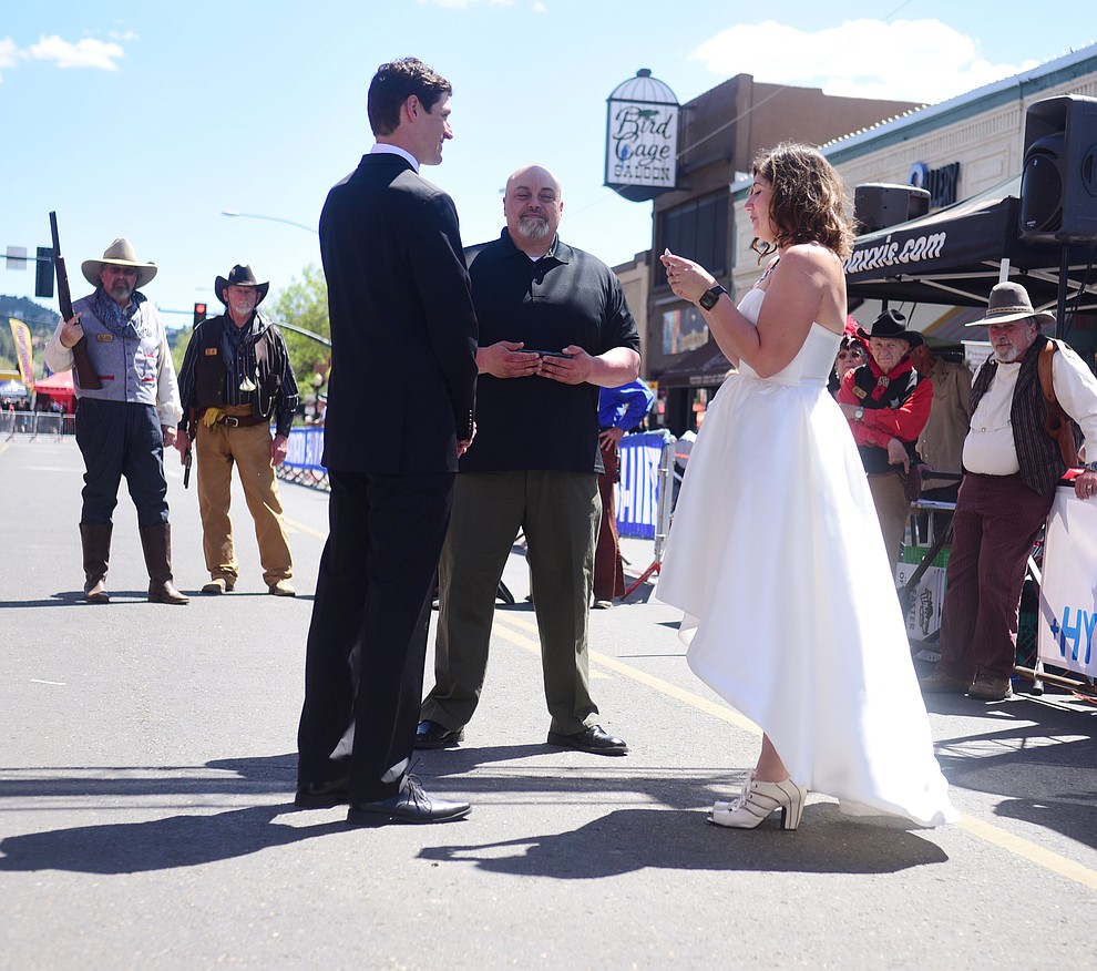 Greg and Bess Dougherty of Indinapolis, IN held their wedding ceremony on the start line on opening day of the Whiskey Off Road in downtown Prescott Friday, April 26. (Les Stukenberg/Courier)