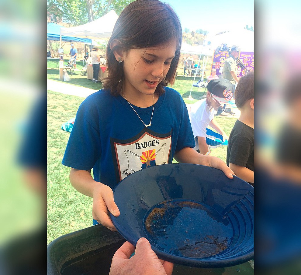 Zoey Beneda pans for gold during Gold Fever Day at Fain Park Saturday, April 27. (Jason Wheeler/Courier)