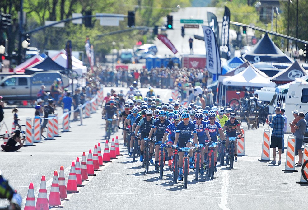 The mens field heads up Goodwin Street during the Whiskey Off Road Pro 50-mile cross country mountain bike race in Prescott Sunday, April 28. (Les Stukenberg/Courier)