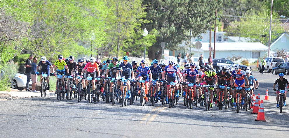 The mens field heads up Goodwin Street during the Whiskey Off Road Pro 50-mile cross country mountain bike race in Prescott Sunday, April 28. (Les Stukenberg/Courier)