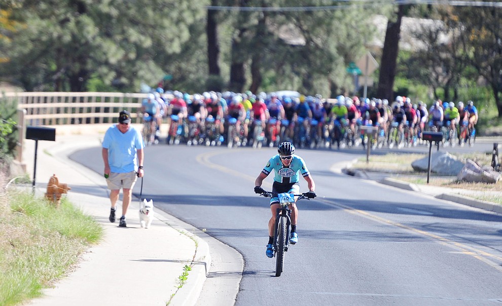 Travis McCabe takes the lead up Copper Basin Road during the Whiskey Off Road Pro 50-mile cross country mountain bike race in Prescott Sunday, April 28. (Les Stukenberg/Courier)