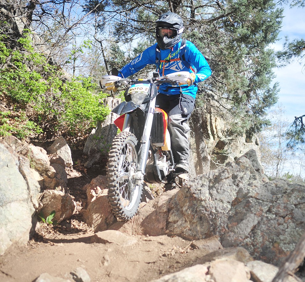John Shumaker on the lead moto during the Whiskey Off Road Pro 50-mile cross country mountain bike race in Prescott Sunday, April 28. (Les Stukenberg/Courier)