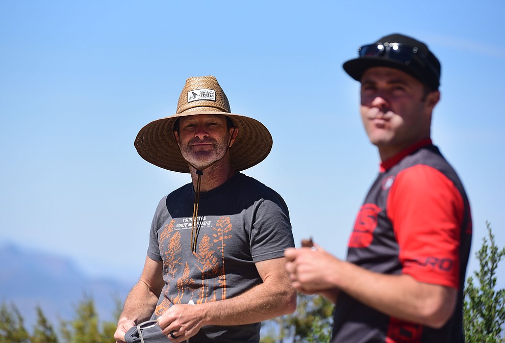 Todd Sadow and Travis Woodruff watch the action at the top of Sierra Prieta during the Whiskey Off Road Pro 50-mile cross country mountain bike race in Prescott Sunday, April 28. (Les Stukenberg/Courier)