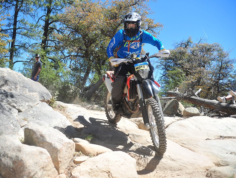 Lead moto John Shumaker during the Whiskey Off Road Pro 50-mile cross country mountain bike race in Prescott Sunday, April 28. (Les Stukenberg/Courier)