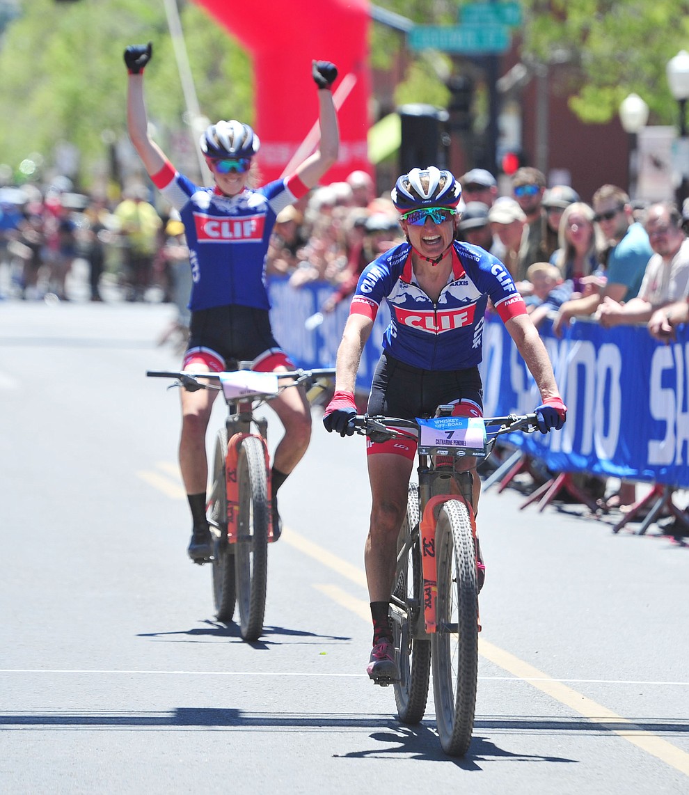 Clif Pro Team's Catharine Pendrel finishes third as teammate Haley Batten celebrates during the Whiskey Off Road Pro 50-mile cross country mountain bike race in Prescott Sunday, April 28. (Les Stukenberg/Courier)