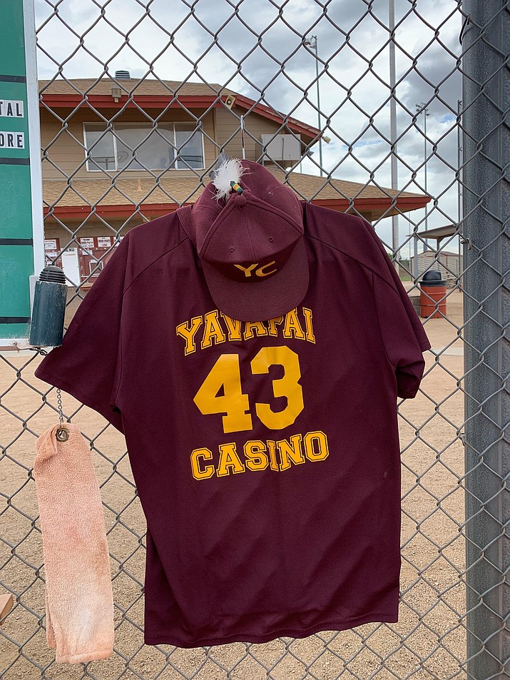 The jersey of the late Ernie Jones hangs in the dugout at Pioneer Park in Prescott as the Prescott Senior Softball league opened its 2019 season Monday, April 29, 2019. (Ted Gambogi/Courtesy)
