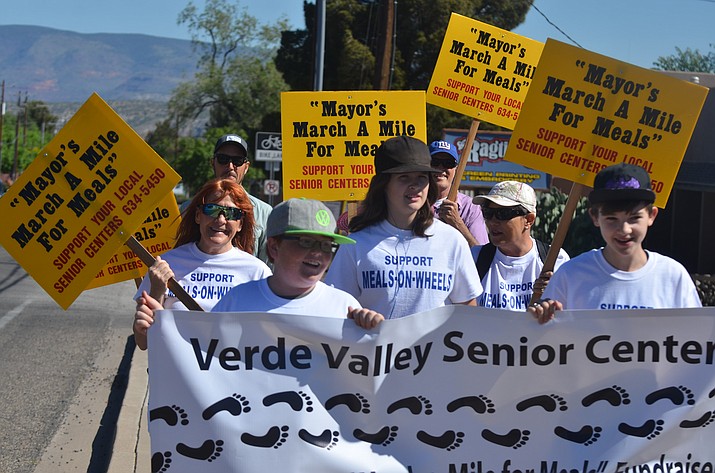 Marchers head up Sixth Street during the 11th annual March-a-Mile for Meals on Saturday. The Verde Valley Senior Center event was held to stamp out senior hunger by walking and pledging to the Meals on Wheels program. VVN/Vyto Starinskas