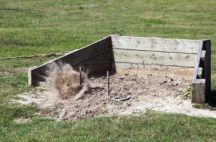 A horseshoe tournament fundraiser is from 9 a.m. – 3 p.m. Saturday, May 4 at the horseshoe pits behind the Kathryn Heidenreich Adult Center to benefit a student summit trip. In this photo, a horseshoe misses its mark during a fun day at Onslow Beach aboard Camp Lejeune, N.C., July 19, 2012. (Photo by Pfc. Franklin E. Mercado/U.S. Marine Corps)
