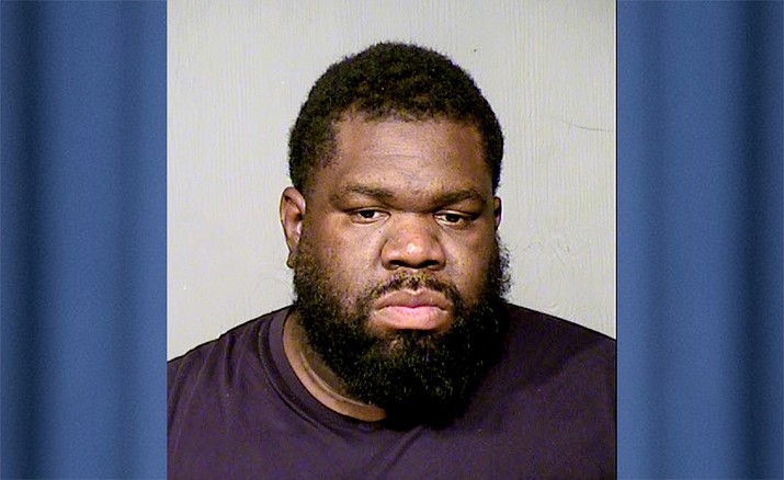 This undated photo provided by the Maricopa County Sheriff's Office shows Isiah Jackson. Jackson was arrested Tuesday, April 30, 2019 in the Phoenix suburb of Surprise, Ariz., on suspicion of aggravated assault and child abuse after his teenage stepdaughter told authorities she was shot with a pellet gun by her stepfather after she was caught hiding stolen food in her clothing, court records say. (Maricopa County Sheriff's Office via AP)