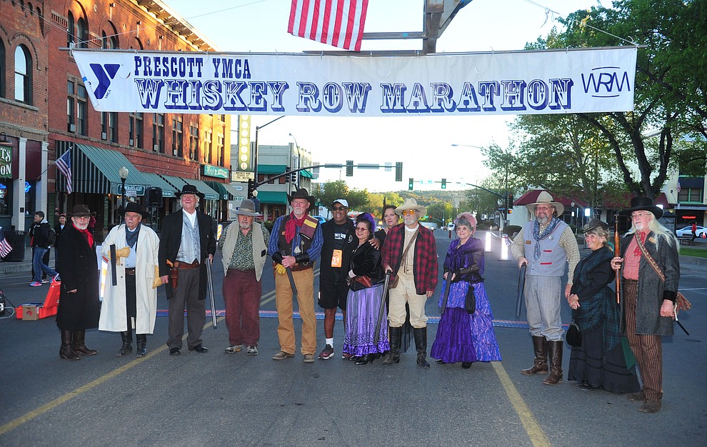 Prescott Regulators and their Shady Ladies pose for a photo during the 41st annual Whiskey Row Marathon Saturday, May 4. (Les Stukenberg/Courier)