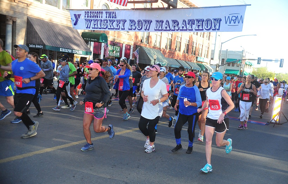 Half marathon runners begin on Montezuma Street during the 41st annual Whiskey Row Marathon Saturday, May 4. (Les Stukenberg/Courier)
