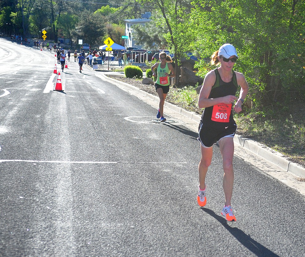 Prescott Valley resident and Bradshaw Mountain High School teacher Randi O'Neill heads up Gurley Street in the half marathon during the 41st annual Whiskey Row Marathon Saturday, May 4. (Les Stukenberg/Courier)
