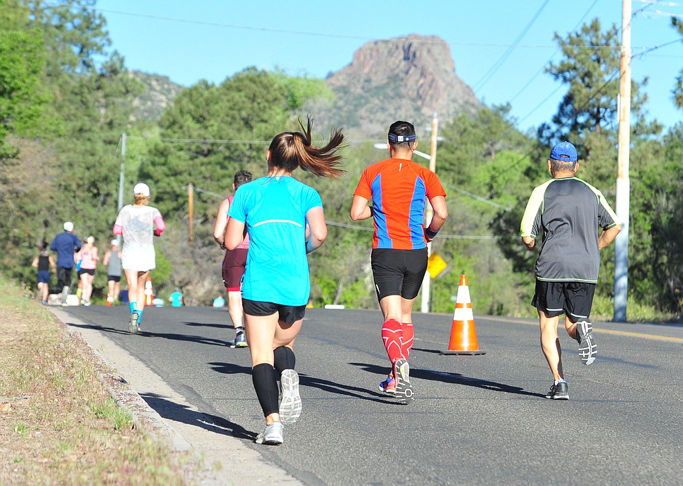 Half-marathon runners head up Gurley Street during the 41st annual Whiskey Row Marathon Saturday, May 4. (Les Stukenberg/Courier)