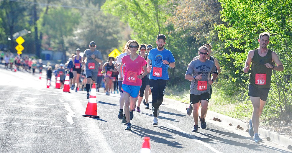 Half-marathon runners head up Gurley Street during the 41st annual Whiskey Row Marathon Saturday, May 4. (Les Stukenberg/Courier)