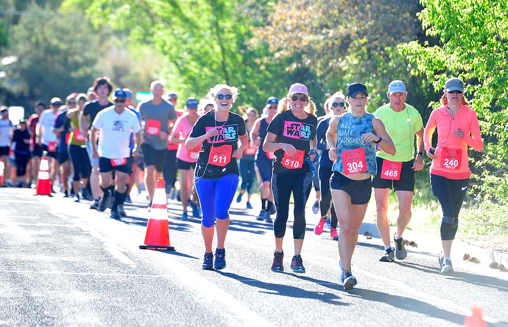 Half-marathon runners head up Gurley Street during the 41st annual Whiskey Row Marathon Saturday, May 4. (Les Stukenberg/Courier)