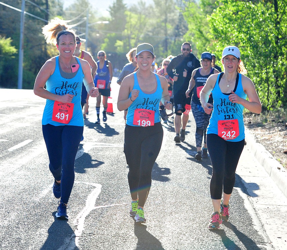 Half-marathon runners head up Gurley Street during the 41st annual Whiskey Row Marathon Saturday, May 4. (Les Stukenberg/Courier)