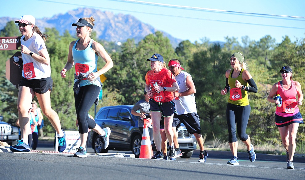 Half-marathon runners head up Copper Basin with Granite Mountain in the background during the 41st annual Whiskey Row Marathon Saturday, May 4. (Les Stukenberg/Courier)