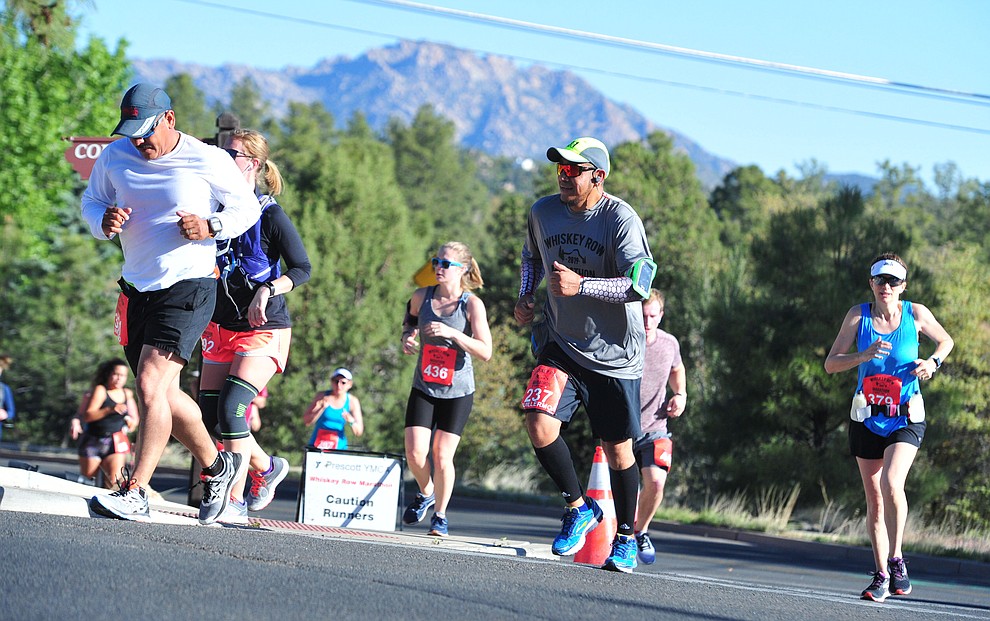 Half-marathon runners head up Copper Basin with Granite Mountain in the background during the 41st annual Whiskey Row Marathon Saturday, May 4. (Les Stukenberg/Courier)